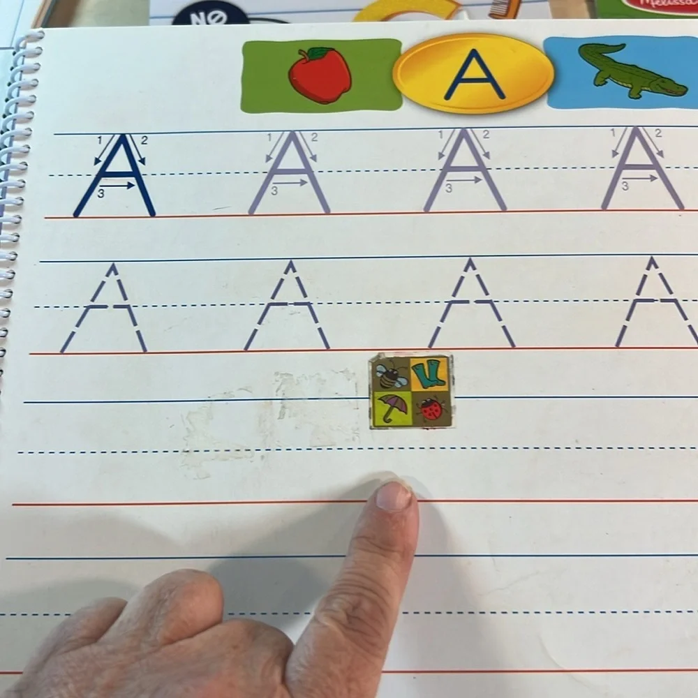 Melissa and Doug Water Wow and Write and Wipe books and dr. Seuss writing paper
